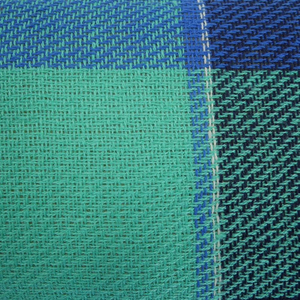 Close up of blue and green tartan picnic rug