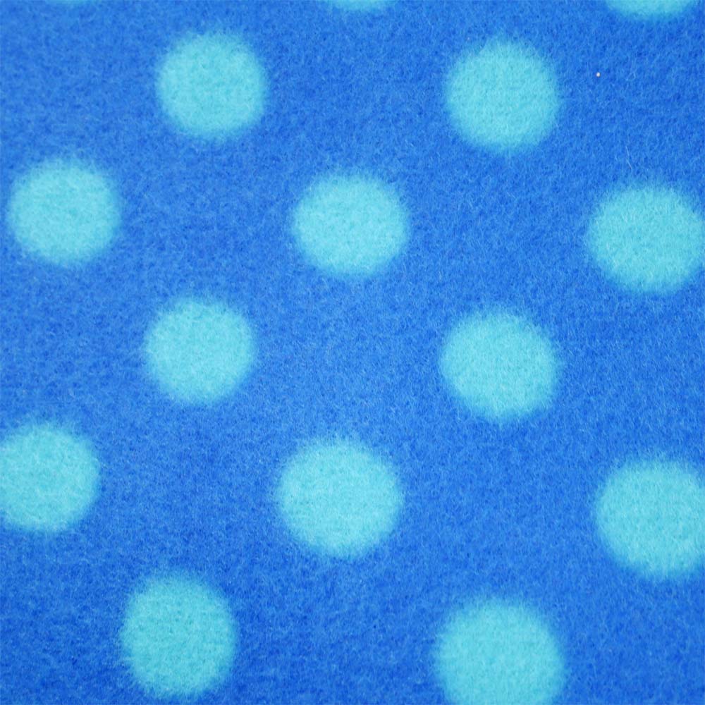 Close up of blue polka dot picnic blanket