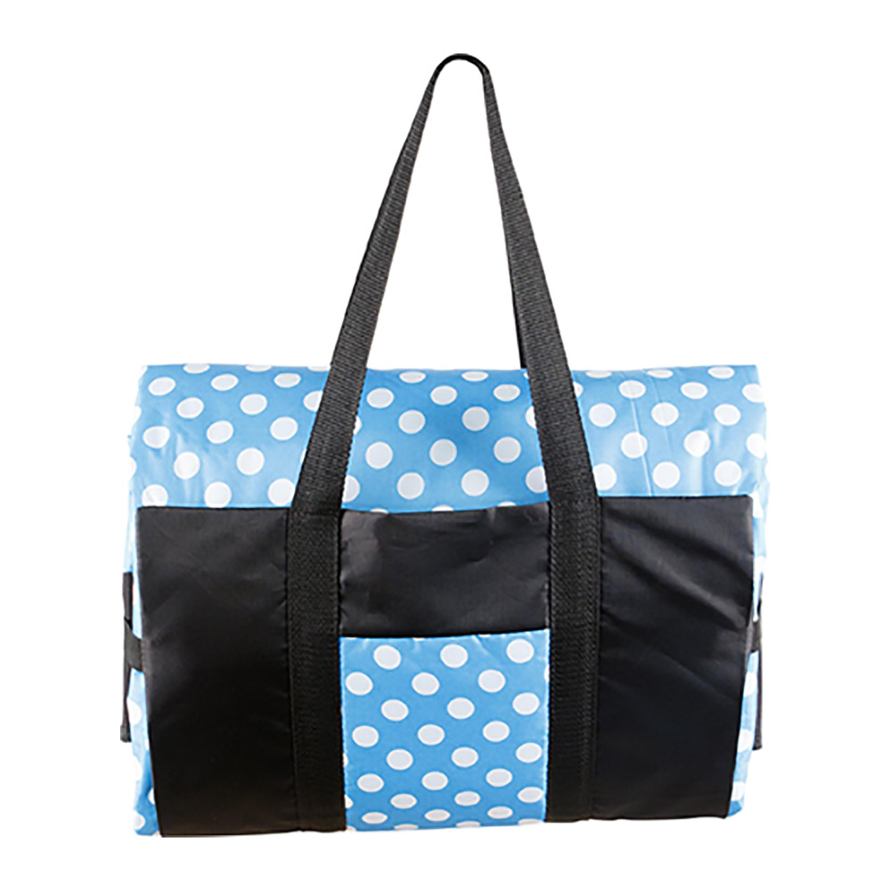 picnic rug with blue and white polka dots in carry bag